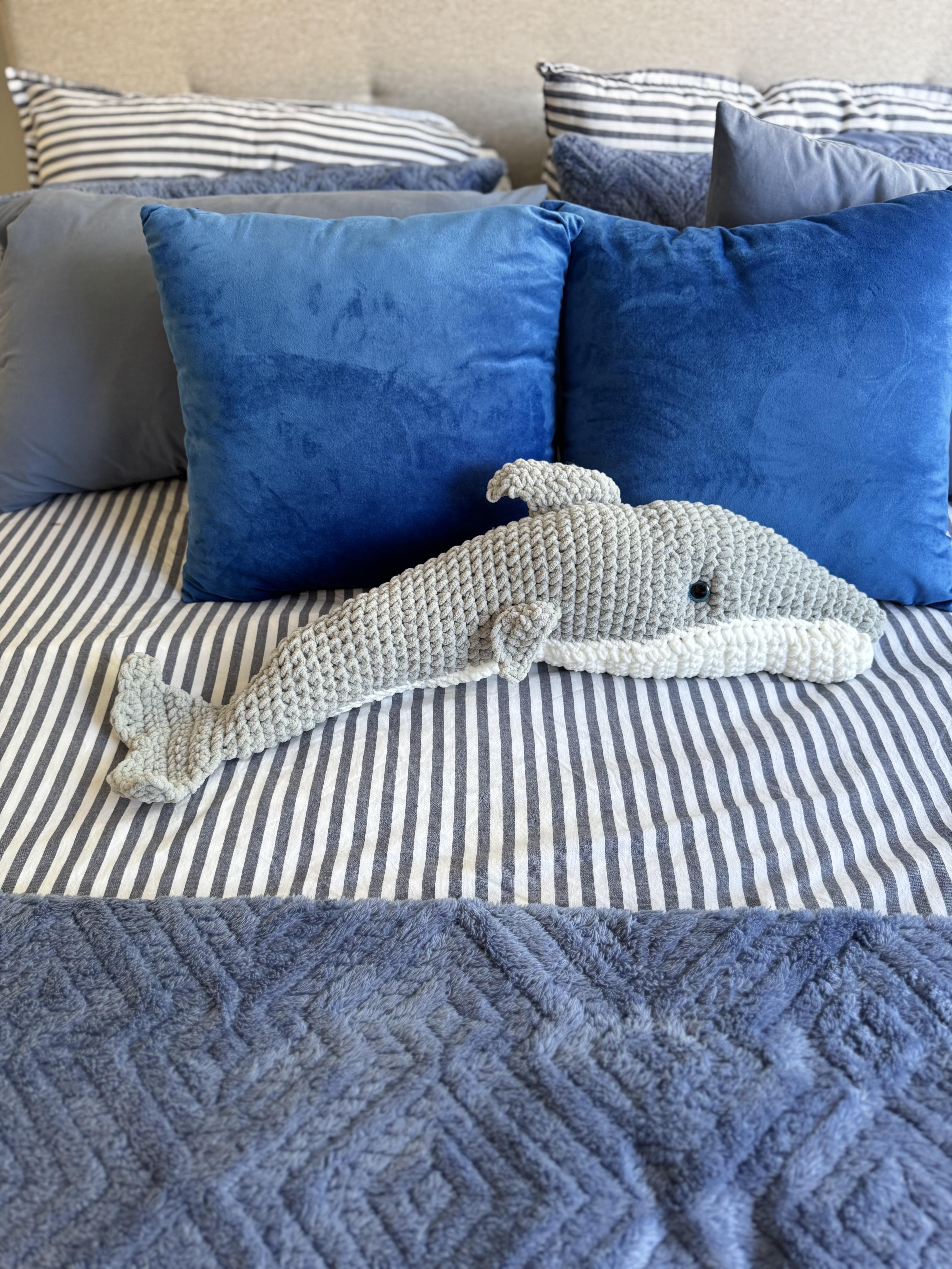 A handmade crochet dolphin